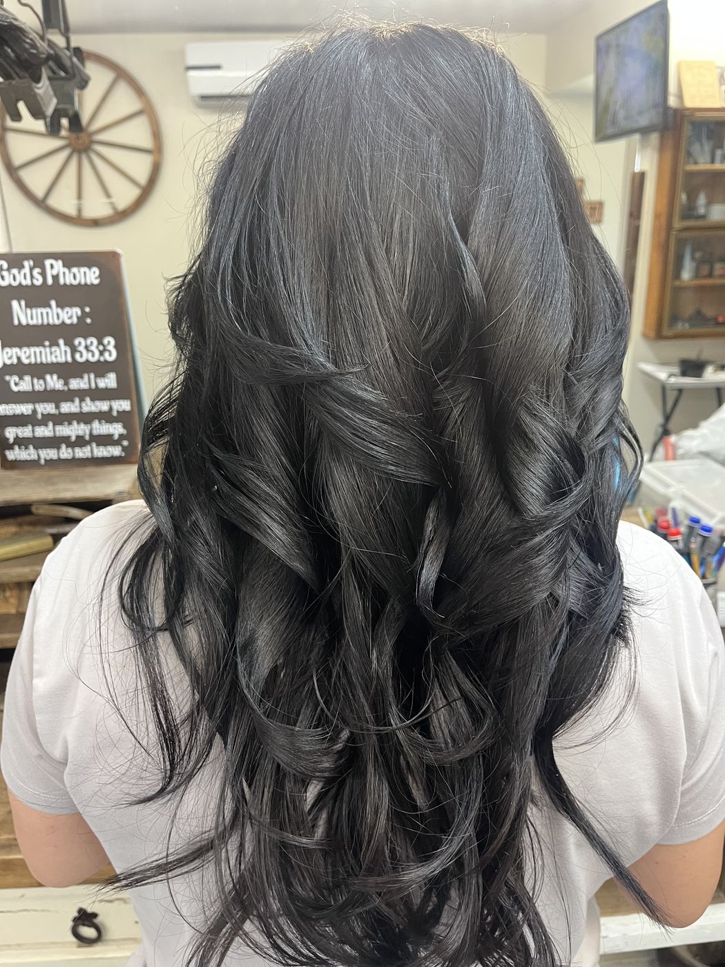 Silver blended through darker hair with soft waves, Hair Barn Tyler TX