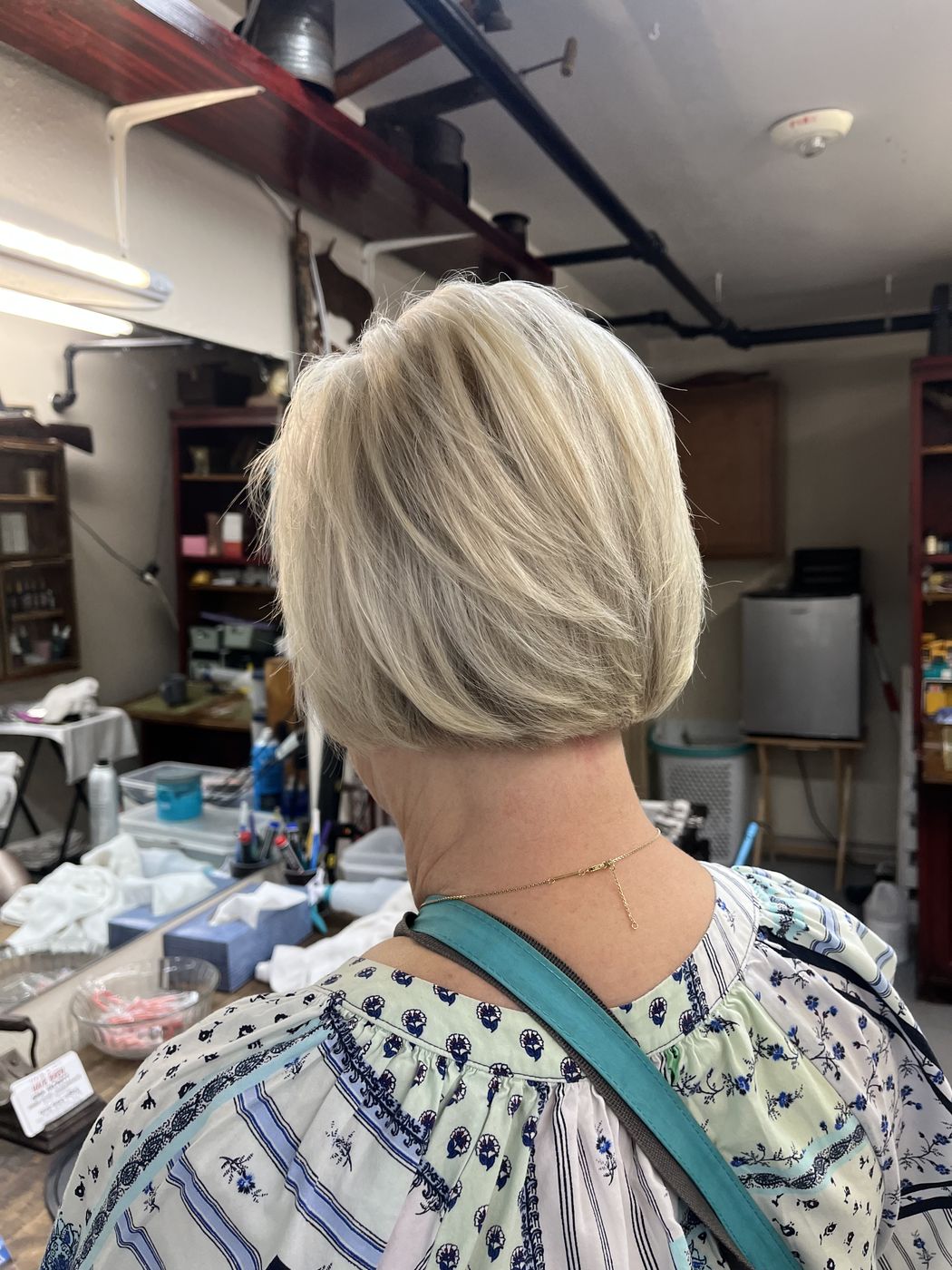 Layered cut with soft curl, styled at Hair Barn
